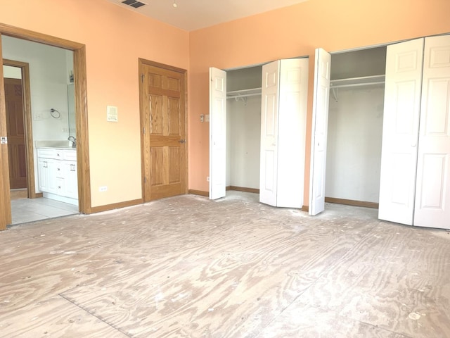 1136 Park Pl, Bellwood, IL 60104 - unfurnished bedroom with multiple closets and connected bathroom