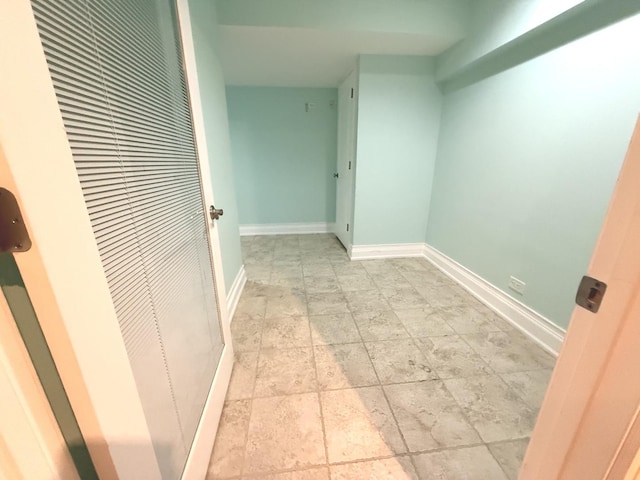 1136 Park Pl, Bellwood, IL 60104 - hall featuring a heating unit and light stone finish flooring