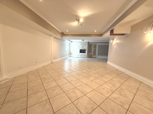 1136 Park Pl, Bellwood, IL 60104 - empty room with light tile patterned floors, crown molding, a fireplace, and a raised ceiling
