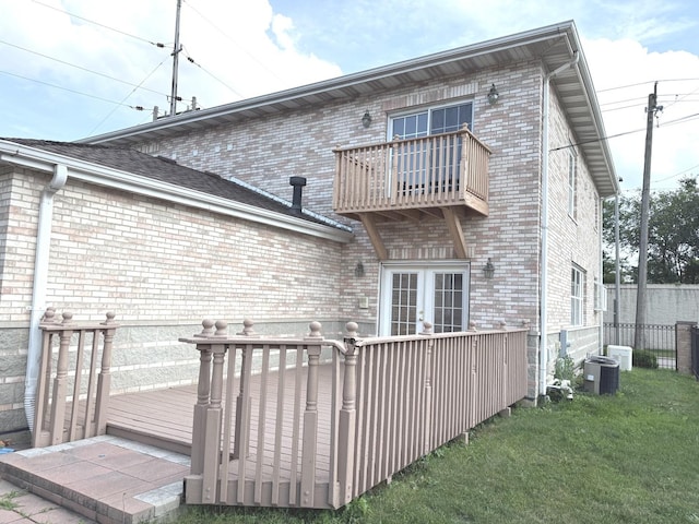 1136 Park Pl, Bellwood, IL 60104 - back of property with a balcony, brick siding, and french doors