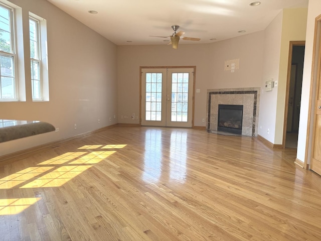 1136 Park Pl, Bellwood, IL 60104 - unfurnished living room featuring ceiling fan, light wood-style flooring, french doors, recessed lighting, and a tile fireplace