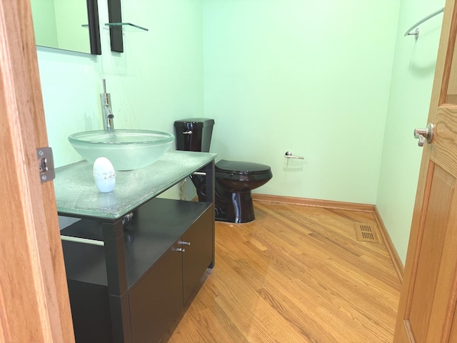 1136 Park Pl, Bellwood, IL 60104 - bathroom with vanity and wood finished floors