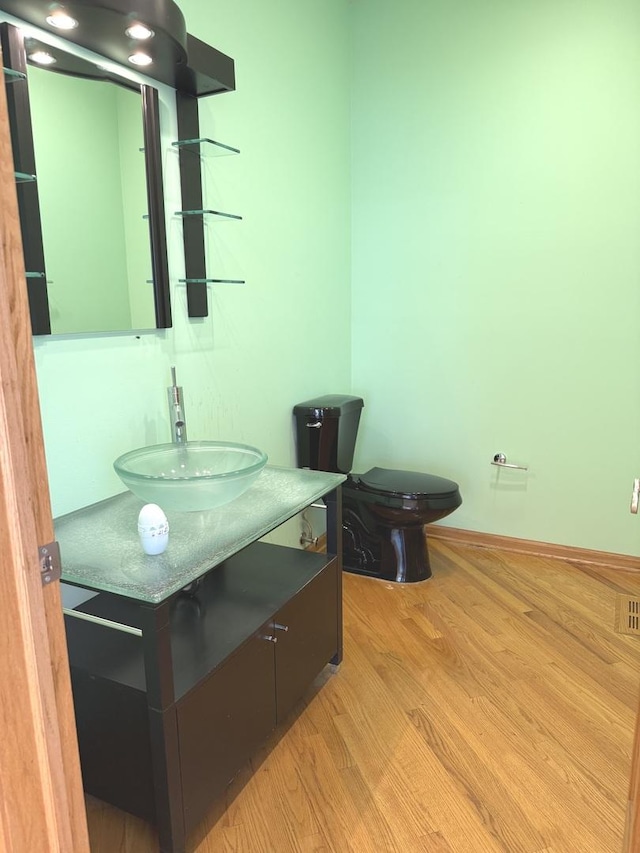 1136 Park Pl, Bellwood, IL 60104 - bathroom featuring vanity and wood finished floors