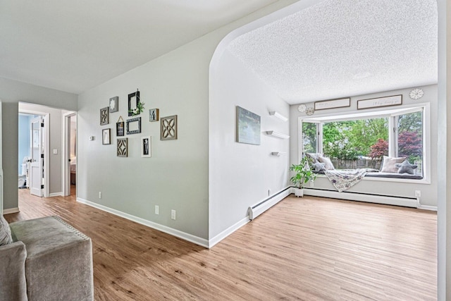 412 E S St, Peotone, IL 60468 - living area with wood finished floors and baseboard heating
