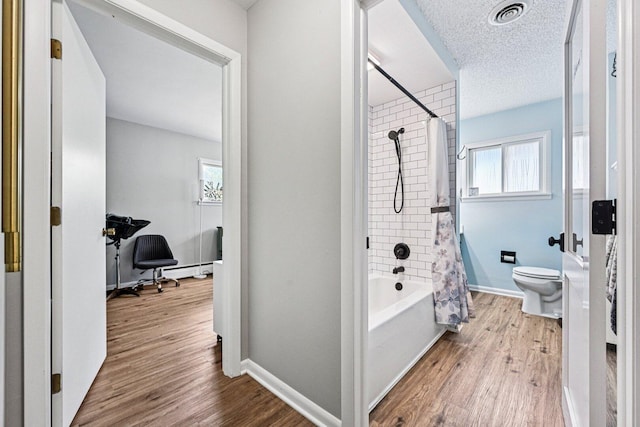 412 E S St, Peotone, IL 60468 - bathroom with plenty of natural light, shower / tub combo, wood finished floors, and a textured ceiling