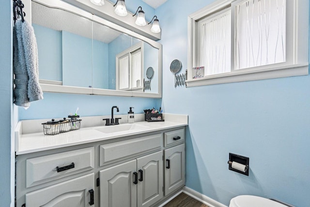 412 E S St, Peotone, IL 60468 - half bath with vanity and wood finished floors
