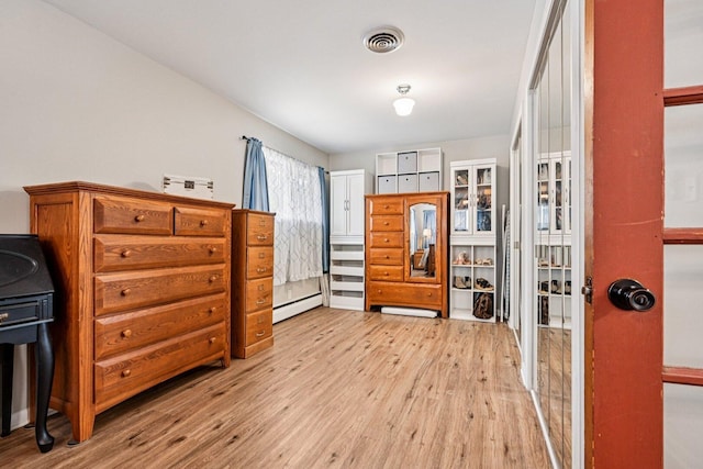412 E S St, Peotone, IL 60468 - entryway featuring light wood-style floors and baseboard heating