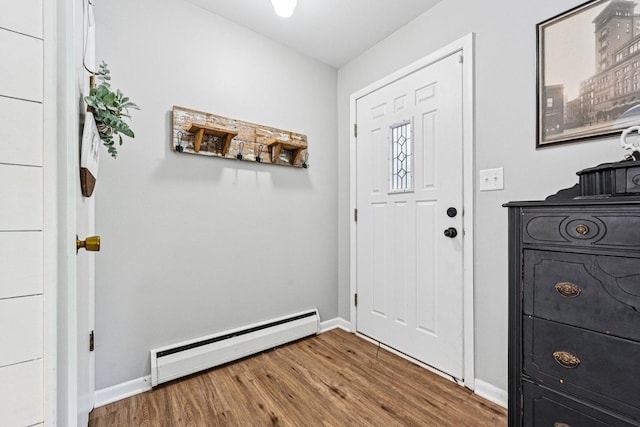 412 E S St, Peotone, IL 60468 - foyer with a baseboard heating unit and wood finished floors