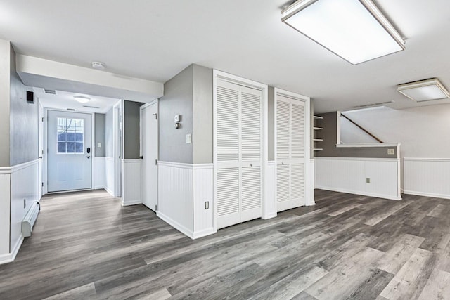 412 E S St, Peotone, IL 60468 - additional living space featuring a baseboard heating unit, a wainscoted wall, and wood finished floors