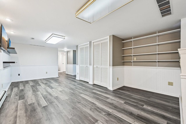 412 E S St, Peotone, IL 60468 - basement with wainscoting, wood finished floors, a fireplace, and baseboard heating