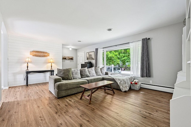 412 E S St, Peotone, IL 60468 - living room with a baseboard heating unit and wood finished floors