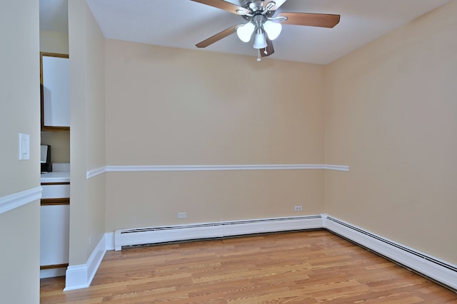 1813 Hemlock Pl Unit 306, Schaumburg, IL 60173 - spare room featuring light wood finished floors, a ceiling fan, and baseboard heating