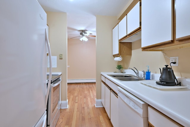 1813 Hemlock Pl Unit 306, Schaumburg, IL 60173 - kitchen with white appliances, a baseboard heating unit, a ceiling fan, light countertops, and light wood-type flooring