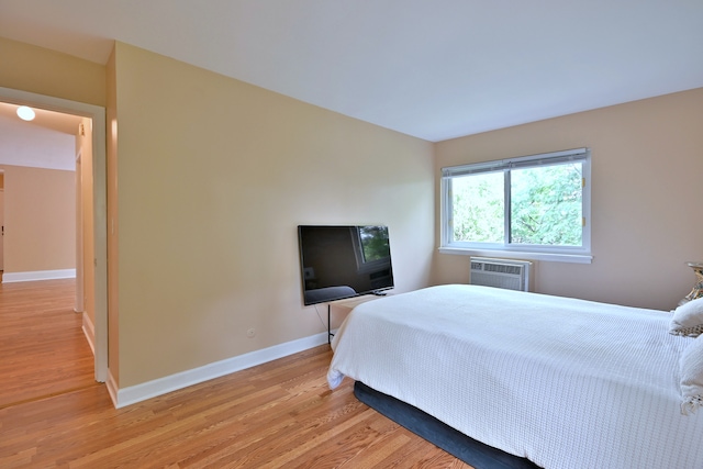 1813 Hemlock Pl Unit 306, Schaumburg, IL 60173 - bedroom featuring light wood-style flooring and a wall unit AC