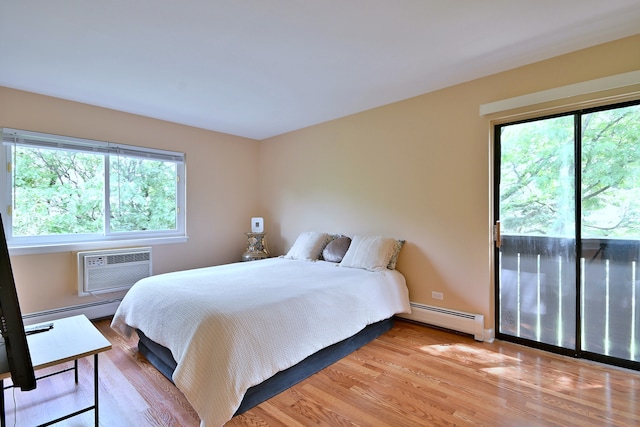 1813 Hemlock Pl Unit 306, Schaumburg, IL 60173 - bedroom featuring a baseboard radiator, multiple windows, and light wood finished floors