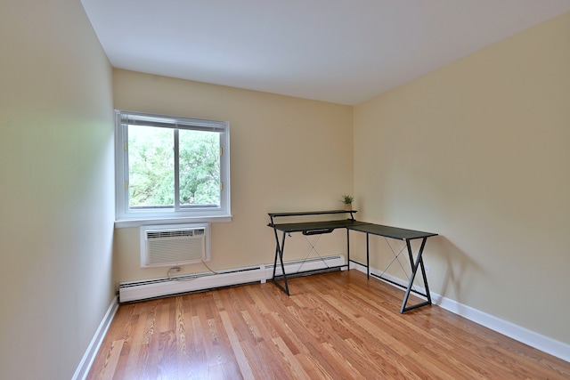 1813 Hemlock Pl Unit 306, Schaumburg, IL 60173 - unfurnished office featuring a baseboard radiator, a wall mounted AC, and light wood finished floors