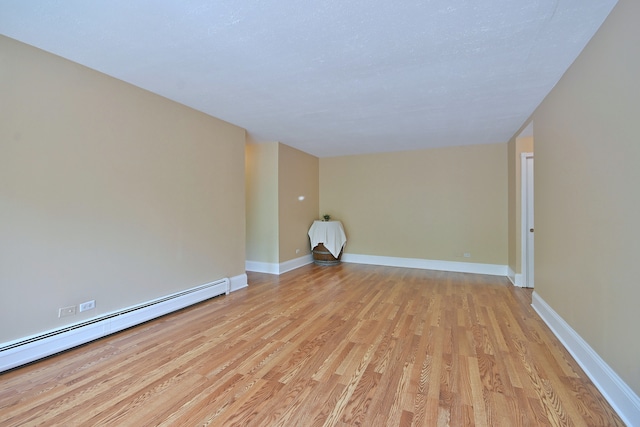 1813 Hemlock Pl Unit 306, Schaumburg, IL 60173 - empty room featuring baseboard heating and light wood finished floors