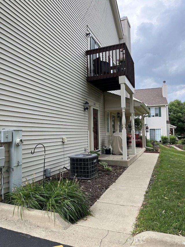 601 Fox Ridge Dr Unit 601, Fox Lake, IL 60020 - view of side of home with a balcony and a central AC unit