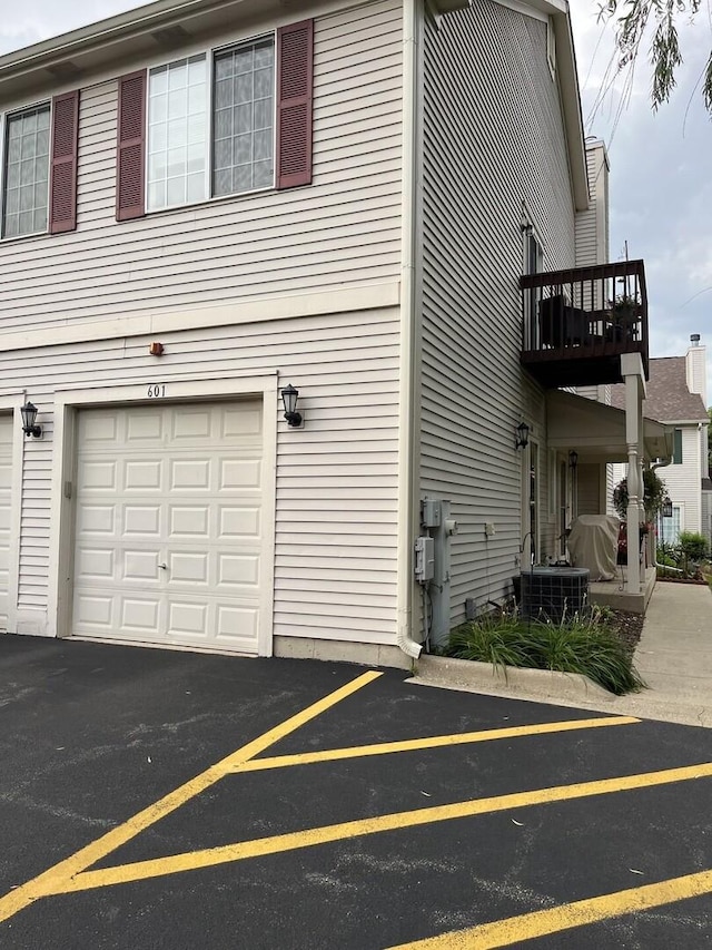 601 Fox Ridge Dr Unit 601, Fox Lake, IL 60020 - view of side of home with an attached garage and a balcony