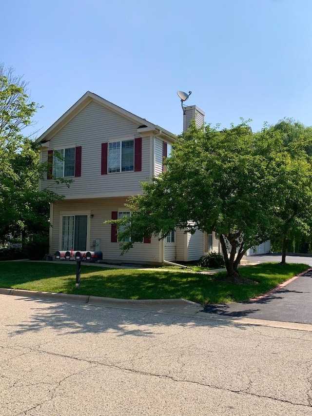 601 Fox Ridge Dr Unit 601, Fox Lake, IL 60020 - view of front of home featuring a front lawn and a chimney