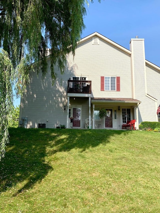 601 Fox Ridge Dr Unit 601, Fox Lake, IL 60020 - back of property featuring a chimney and a yard