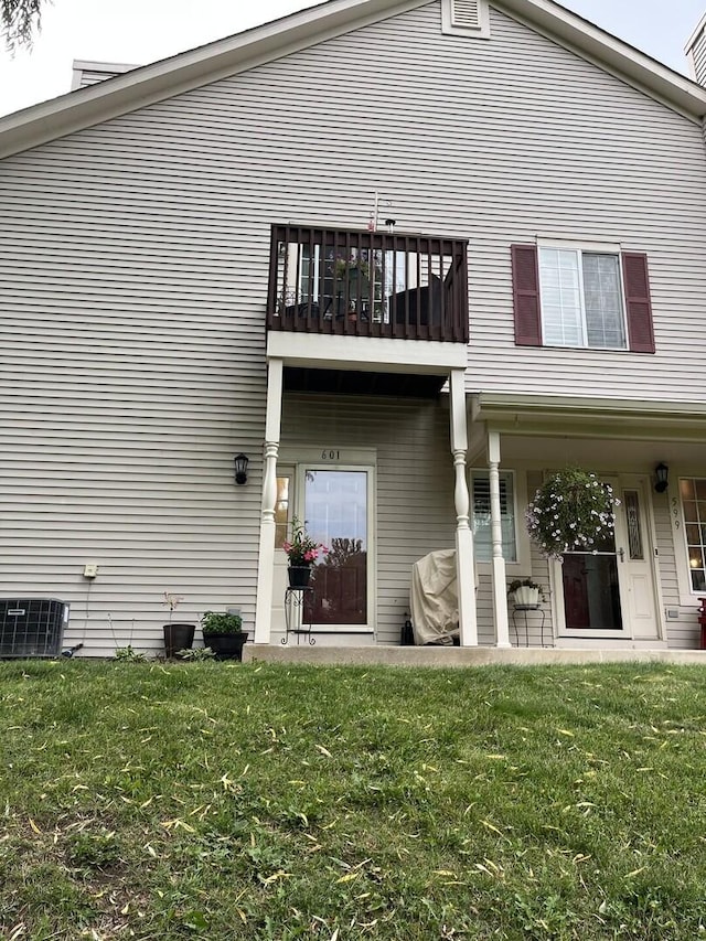 601 Fox Ridge Dr Unit 601, Fox Lake, IL 60020 - rear view of property featuring a balcony and a lawn