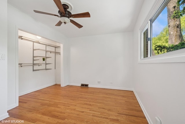 2208 Foster St Unit A, Evanston, IL 60201 - empty room with light wood-style floors and ceiling fan