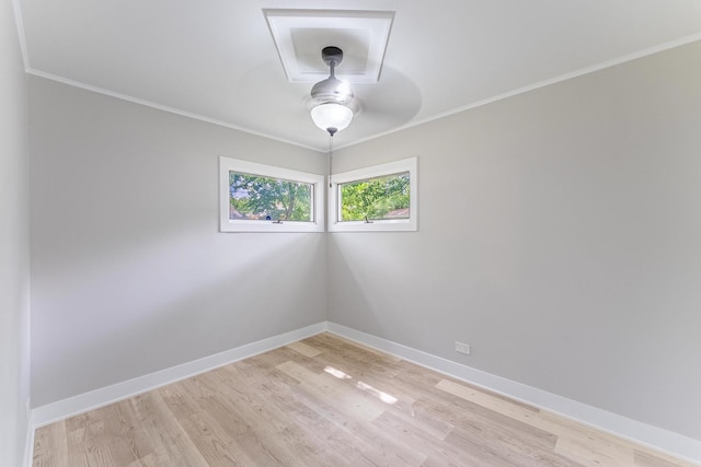 437 Winnebago St, Park Forest, IL 60466 - spare room featuring a ceiling fan, light wood-type flooring, and crown molding