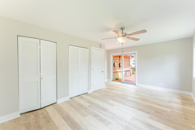 437 Winnebago St, Park Forest, IL 60466 - unfurnished bedroom featuring two closets, light wood-type flooring, and ceiling fan