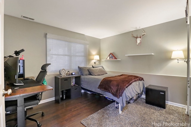 809 W Sheridan Rd, Mchenry, IL 60051 - bedroom featuring wood finished floors and an office area