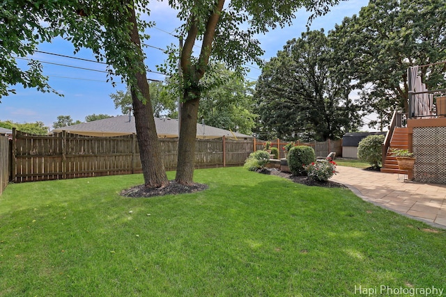 809 W Sheridan Rd, Mchenry, IL 60051 - fenced backyard with stairway and a patio