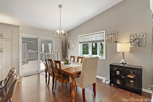 809 W Sheridan Rd, Mchenry, IL 60051 - dining room with lofted ceiling, a chandelier, and dark wood finished floors