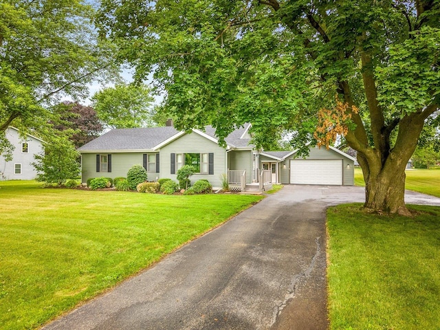 512 S Elida St, Winnebago, IL 61088 - single story home featuring driveway, a front yard, an attached garage, and a chimney