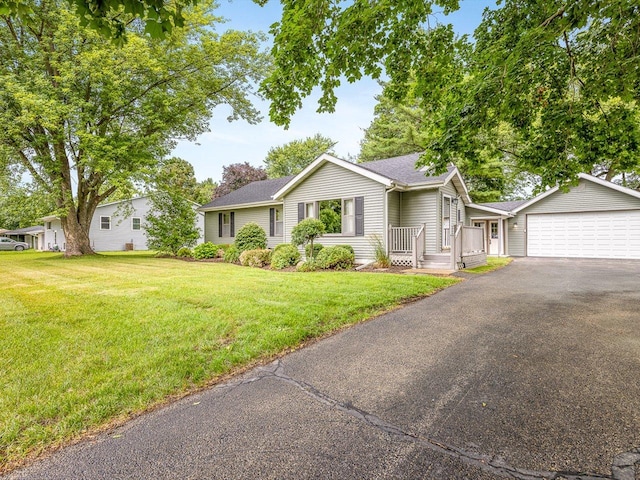 512 S Elida St, Winnebago, IL 61088 - ranch-style home featuring asphalt driveway, an attached garage, a front yard, and roof with shingles
