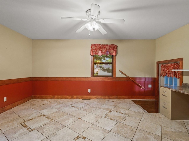 512 S Elida St, Winnebago, IL 61088 - spare room with a ceiling fan and baseboards
