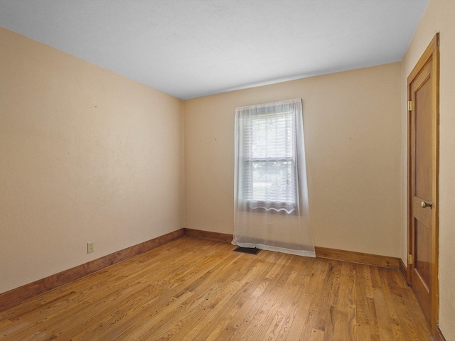 512 S Elida St, Winnebago, IL 61088 - spare room featuring baseboards and light wood-style flooring