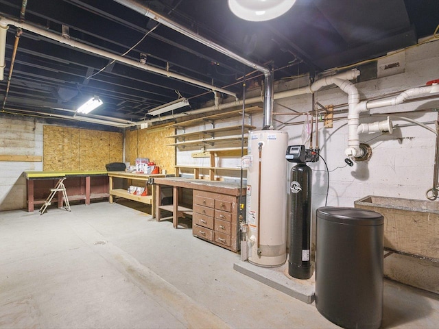 512 S Elida St, Winnebago, IL 61088 - unfinished basement featuring gas water heater, a workshop area, and a water softener system
