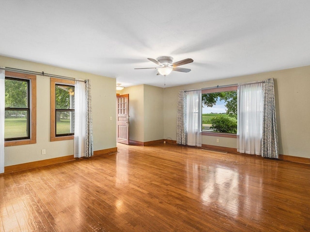 512 S Elida St, Winnebago, IL 61088 - unfurnished room with healthy amount of natural light, wood finished floors, and a ceiling fan