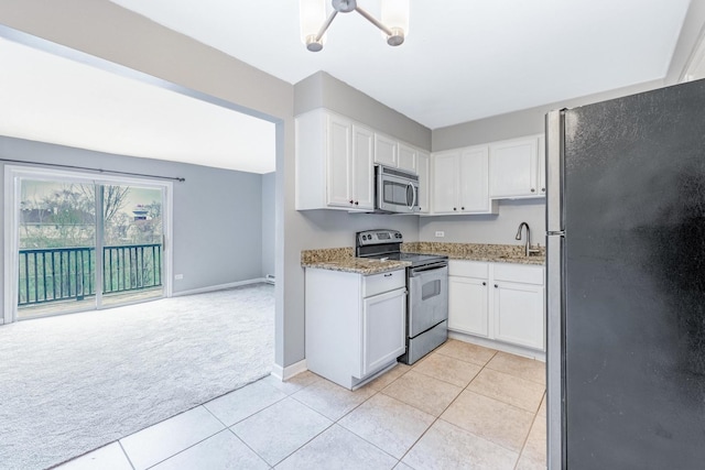 4309 W Park Lane Dr Unit 2B, Alsip, IL 60803 - kitchen featuring stainless steel appliances, light carpet, white cabinetry, light tile patterned flooring, and light stone countertops