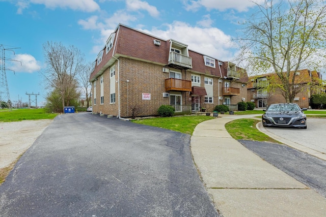 4309 W Park Lane Dr Unit 2B, Alsip, IL 60803 - exterior space featuring brick siding, mansard roof, and a residential view