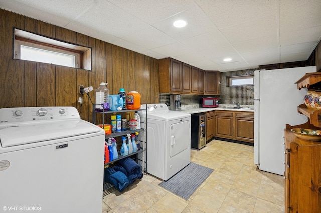 10245 Mcnerney Dr, Franklin Park, IL 60131 - washroom with plenty of natural light, washing machine and clothes dryer, and wooden walls