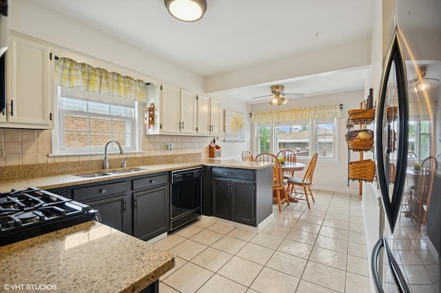 10245 Mcnerney Dr, Franklin Park, IL 60131 - kitchen featuring freestanding refrigerator, dishwasher, tasteful backsplash, and white cabinetry