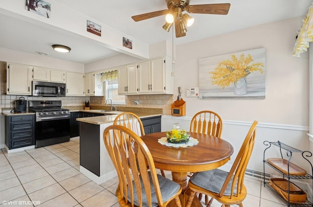 10245 Mcnerney Dr, Franklin Park, IL 60131 - dining area with light tile patterned floors and a ceiling fan