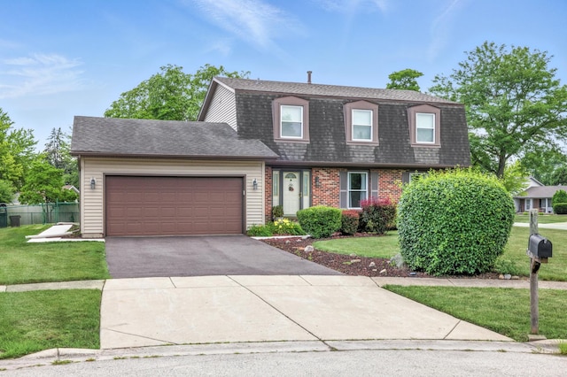 1021 Mobile Cir, Elk Grove Village, IL 60007 - colonial inspired home featuring asphalt driveway, a garage, and roof with shingles