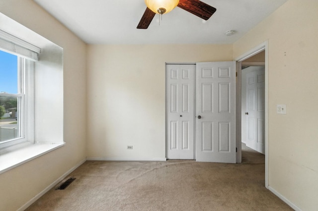 1021 Mobile Cir, Elk Grove Village, IL 60007 - unfurnished bedroom featuring carpet flooring, a closet, and ceiling fan