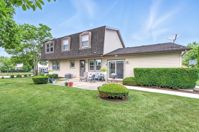 1021 Mobile Cir, Elk Grove Village, IL 60007 - back of property featuring a patio area, a yard, roof with shingles, and a gambrel roof