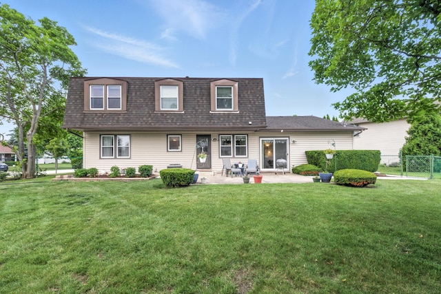 1021 Mobile Cir, Elk Grove Village, IL 60007 - back of property with a shingled roof, a patio area, and mansard roof