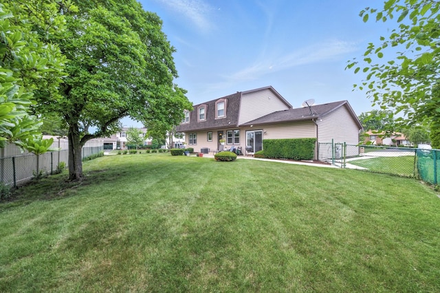 1021 Mobile Cir, Elk Grove Village, IL 60007 - rear view of house with a fenced backyard, roof with shingles, and a patio area