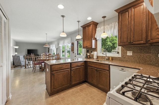 1021 Mobile Cir, Elk Grove Village, IL 60007 - kitchen with backsplash, a peninsula, white appliances, decorative light fixtures, and recessed lighting