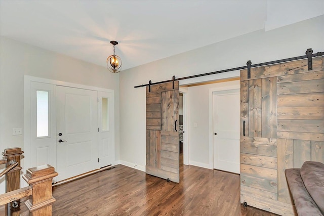 24401 S Clydesdale Ct, Manhattan, IL 60442 - foyer with a barn door and dark wood-style flooring